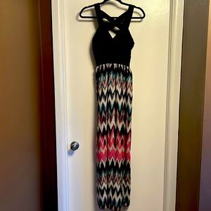 Maxi Dress size 9. Fitted black crisscross top with colored skirt
